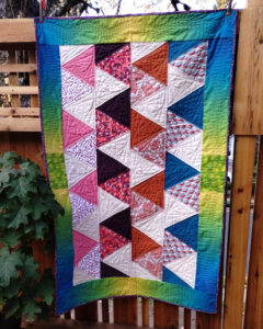 A lap quilt in multiple diamond shapes